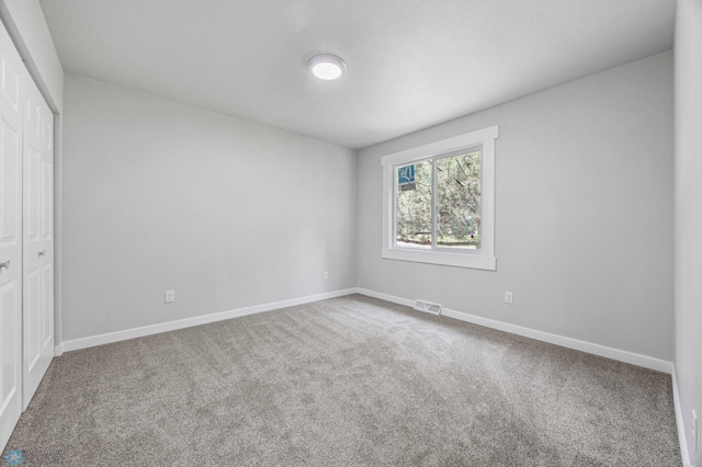 1031 7th St W, West Fargo, ND 58078 - unfurnished bedroom featuring a closet and carpet flooring