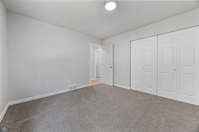 1031 7th St W, West Fargo, ND 58078 - unfurnished bedroom featuring carpet floors and a closet