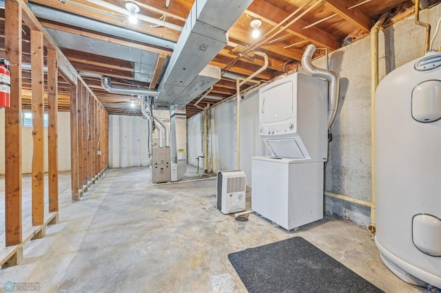 1031 7th St W, West Fargo, ND 58078 - unfinished basement featuring stacked washing machine and dryer, water heater, and heating unit