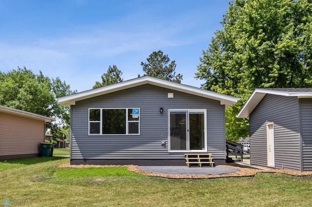 1031 7th St W, West Fargo, ND 58078 - rear view of property featuring a yard and entry steps