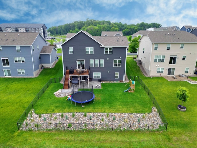 1615 Tamarack Rd, Shakopee, MN 55379 - rear view of property featuring a deck, stairway, a residential view, a fenced backyard, and a playground