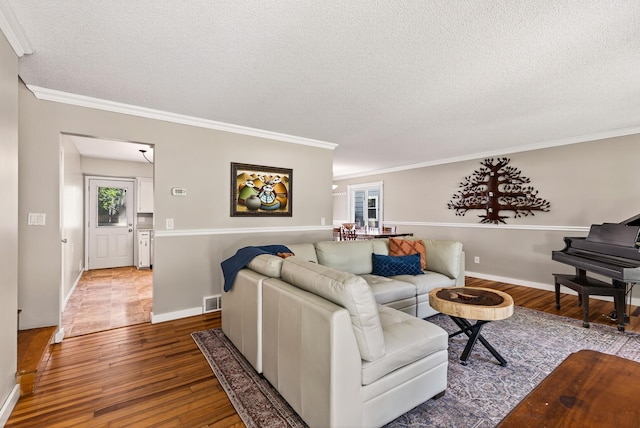 4128 Zane Ave N, Robbinsdale, MN 55422 - living area featuring hardwood / wood-style flooring, a textured ceiling, and ornamental molding
