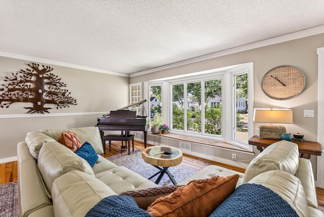 4128 Zane Ave N, Robbinsdale, MN 55422 - living area featuring wood finished floors, a textured ceiling, and ornamental molding