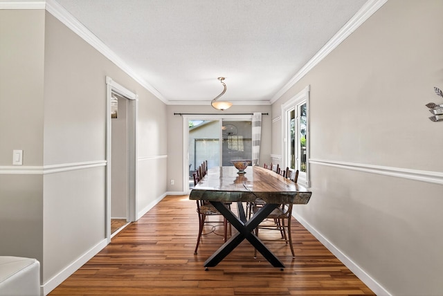 4128 Zane Ave N, Robbinsdale, MN 55422 - dining area with wood finished floors and ornamental molding