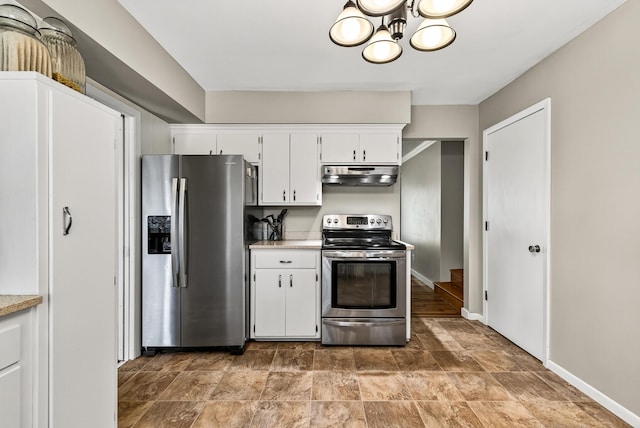 4128 Zane Ave N, Robbinsdale, MN 55422 - kitchen with stainless steel appliances, under cabinet range hood, white cabinetry, and light countertops