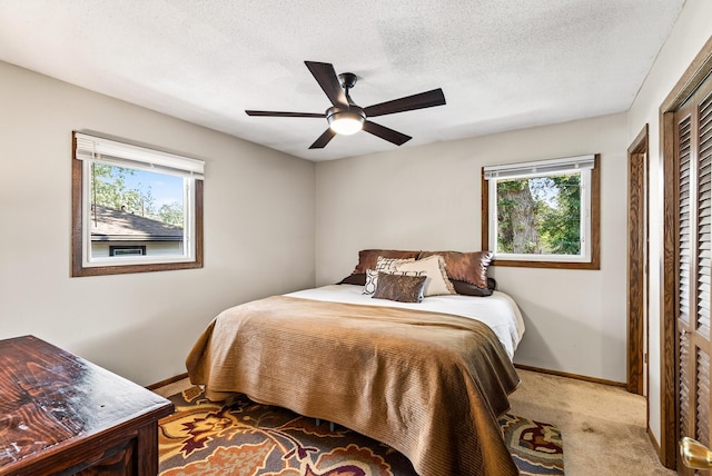 4128 Zane Ave N, Robbinsdale, MN 55422 - bedroom featuring carpet, a ceiling fan, and a textured ceiling