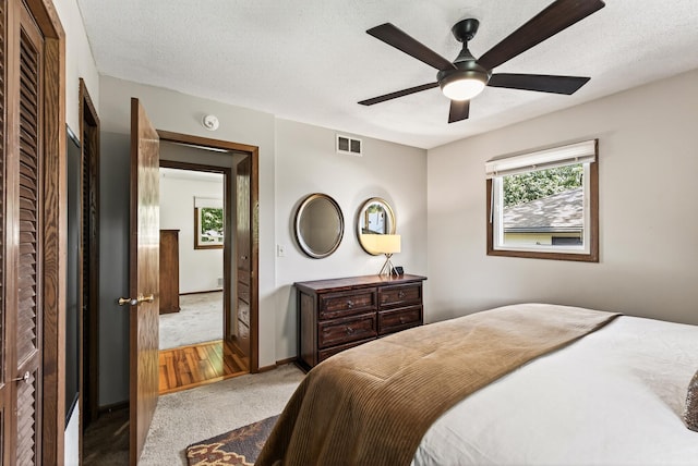 4128 Zane Ave N, Robbinsdale, MN 55422 - carpeted bedroom with ceiling fan and a textured ceiling