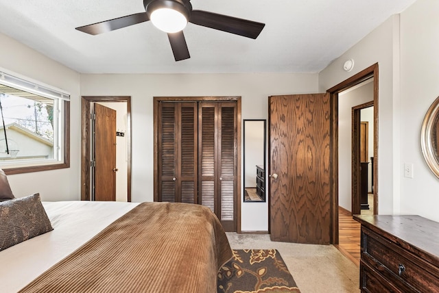 4128 Zane Ave N, Robbinsdale, MN 55422 - bedroom featuring light carpet, ceiling fan, and multiple closets