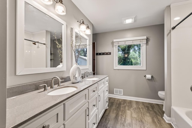 4128 Zane Ave N, Robbinsdale, MN 55422 - full bathroom with wood finished floors and double vanity