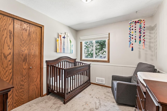 4128 Zane Ave N, Robbinsdale, MN 55422 - bedroom with light colored carpet and a crib