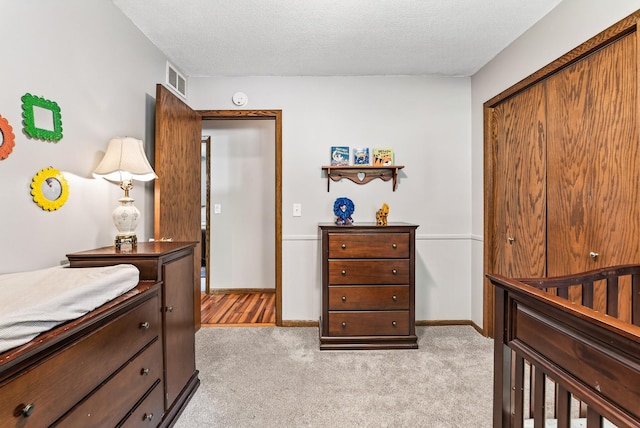 4128 Zane Ave N, Robbinsdale, MN 55422 - bedroom featuring light colored carpet and a textured ceiling