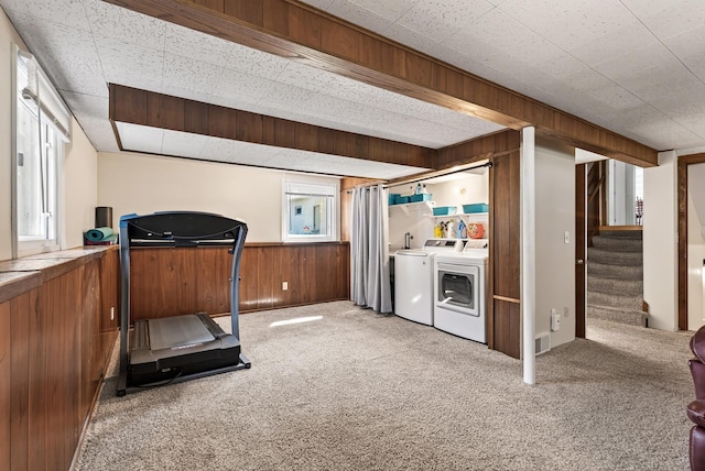 4128 Zane Ave N, Robbinsdale, MN 55422 - exercise area with washer and clothes dryer, light colored carpet, wooden walls, and wainscoting