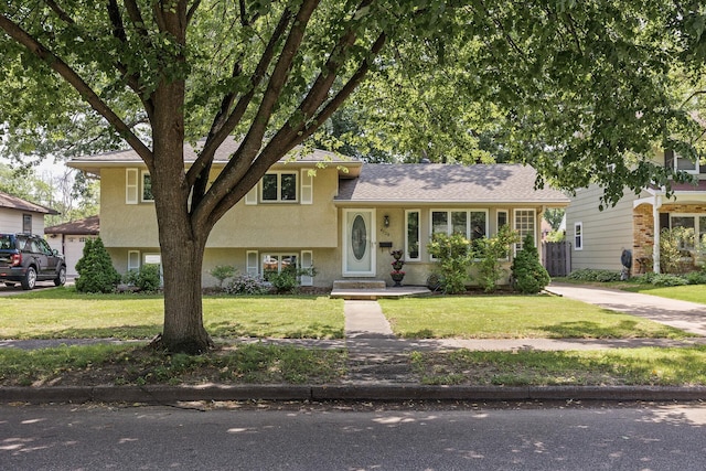 4128 Zane Ave N, Robbinsdale, MN 55422 - tri-level home with stucco siding and a front lawn