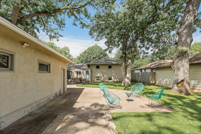 4128 Zane Ave N, Robbinsdale, MN 55422 - view of grassy yard with a patio area