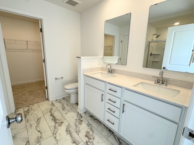 2455 Jandell Ave NE, Saint Michael, MN 55376 - full bathroom with marble finish floors, double vanity, a walk in closet, and a shower stall