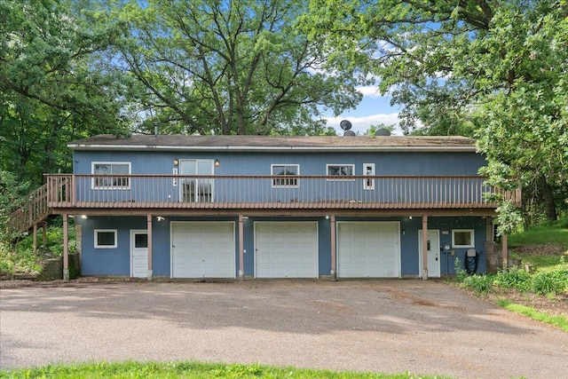 2224 75th Ave Unit M, Osceola, WI 54020 - view of front facade with a deck and a garage