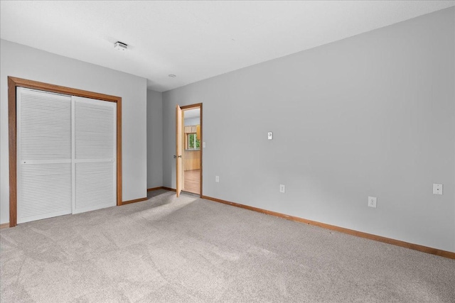 2224 75th Ave Unit M, Osceola, WI 54020 - unfurnished bedroom featuring carpet floors and a closet