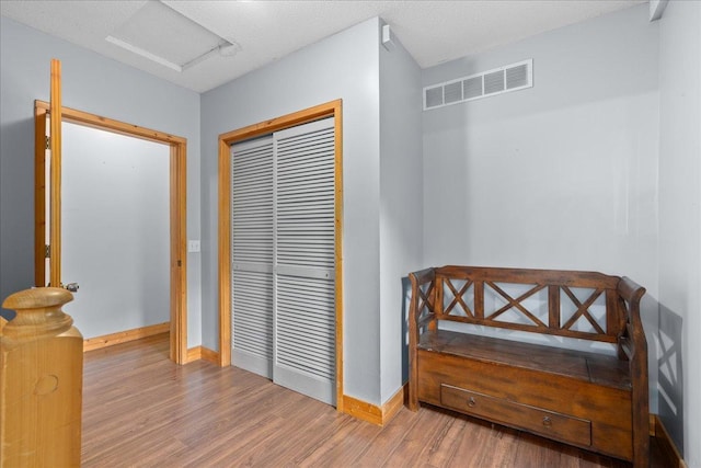 2224 75th Ave Unit M, Osceola, WI 54020 - hall with wood finished floors and attic access