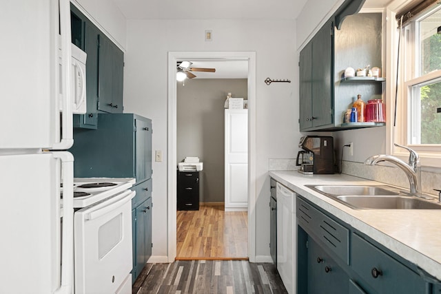 522 14th St NE, Owatonna, MN 55060 - kitchen with white appliances, a ceiling fan, light countertops, and dark wood-style floors