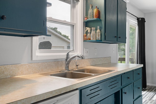 522 14th St NE, Owatonna, MN 55060 - kitchen with light countertops and blue cabinets