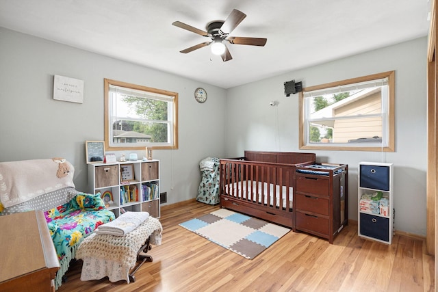 522 14th St NE, Owatonna, MN 55060 - bedroom featuring wood finished floors and a ceiling fan