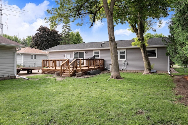 522 14th St NE, Owatonna, MN 55060 - rear view of house with a deck and a lawn
