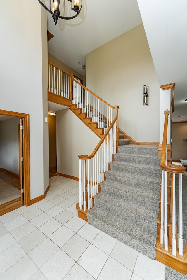 4354 48th St NE, Haverhill Twp, MN 55906 - stairway with a chandelier and tile patterned floors