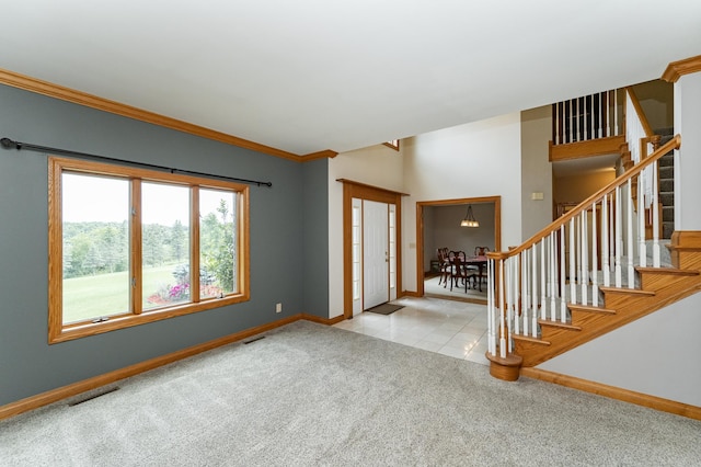 4354 48th St NE, Haverhill Twp, MN 55906 - foyer entrance with carpet, stairs, and crown molding