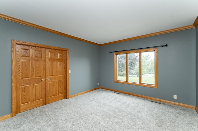 4354 48th St NE, Haverhill Twp, MN 55906 - unfurnished bedroom featuring carpet flooring, crown molding, and a closet