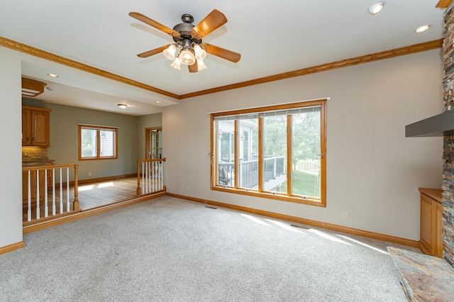 4354 48th St NE, Haverhill Twp, MN 55906 - spare room featuring light carpet, ceiling fan, crown molding, recessed lighting, and a fireplace