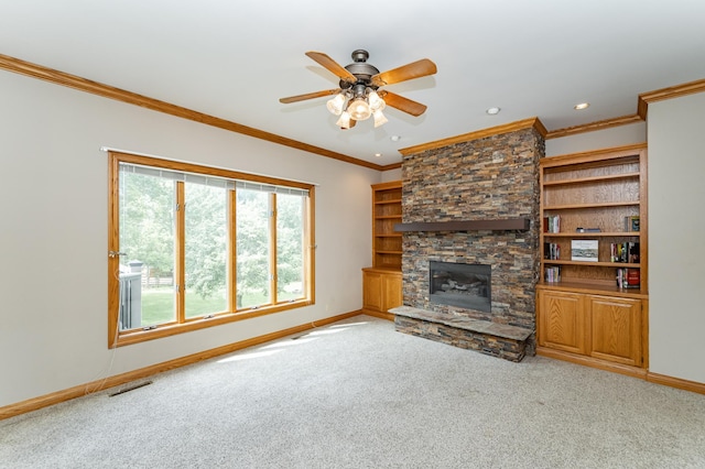 4354 48th St NE, Haverhill Twp, MN 55906 - unfurnished living room featuring carpet, a ceiling fan, a stone fireplace, ornamental molding, and recessed lighting
