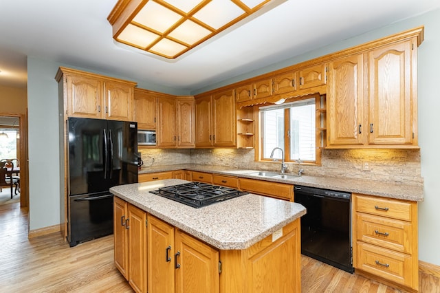 4354 48th St NE, Haverhill Twp, MN 55906 - kitchen featuring black appliances, plenty of natural light, light wood-style floors, and a kitchen island