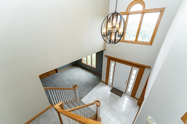 4354 48th St NE, Haverhill Twp, MN 55906 - entryway with light carpet, plenty of natural light, a chandelier, and a high ceiling