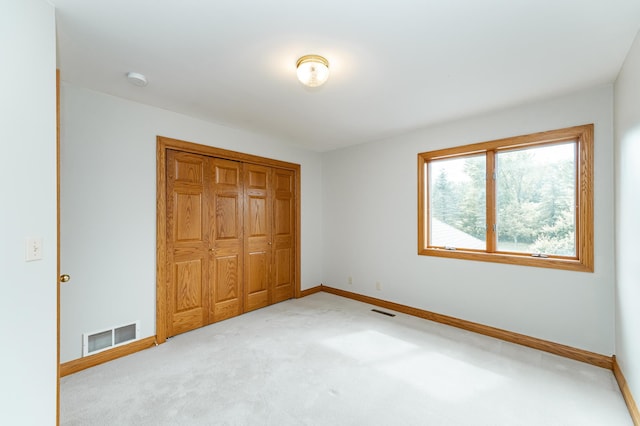 4354 48th St NE, Haverhill Twp, MN 55906 - unfurnished bedroom with carpet flooring and a closet