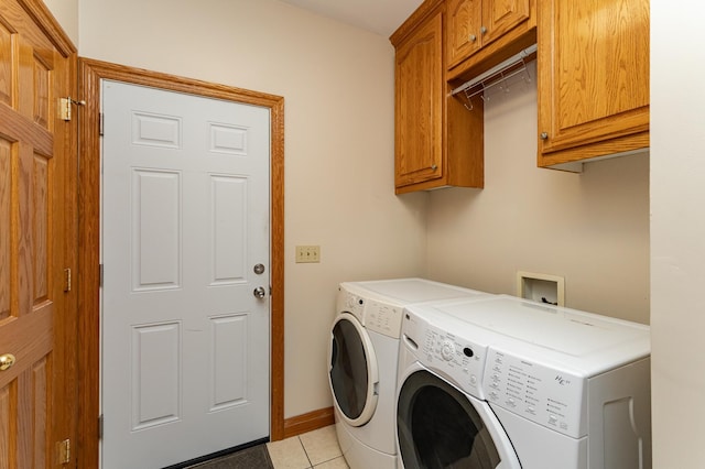 4354 48th St NE, Haverhill Twp, MN 55906 - laundry room with cabinet space, washing machine and dryer, and light tile patterned floors