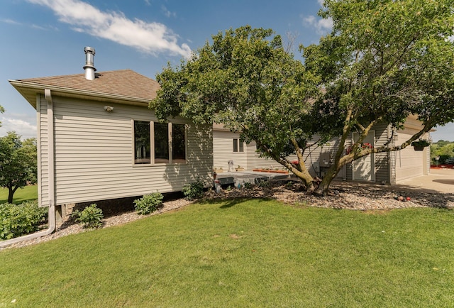 4354 48th St NE, Haverhill Twp, MN 55906 - back of property featuring a yard, a garage, and concrete driveway