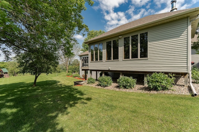 4354 48th St NE, Haverhill Twp, MN 55906 - view of side of home featuring a yard and a shingled roof
