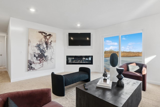 7642 Rainy Ln, Lino Lakes, MN 55038 - living room featuring light carpet, recessed lighting, and a glass covered fireplace