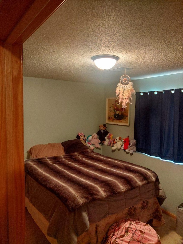 608 11th Ave SW, Rice, MN 56367 - bedroom featuring a textured ceiling