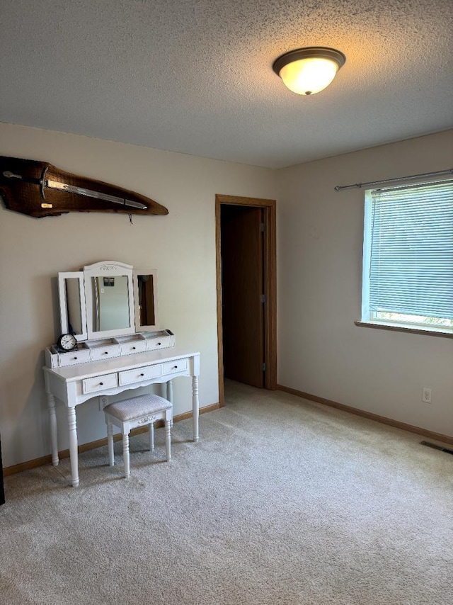 608 11th Ave SW, Rice, MN 56367 - carpeted bedroom featuring a textured ceiling and baseboards
