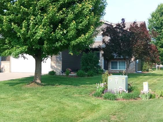608 11th Ave SW, Rice, MN 56367 - view of property hidden behind natural elements featuring a front yard