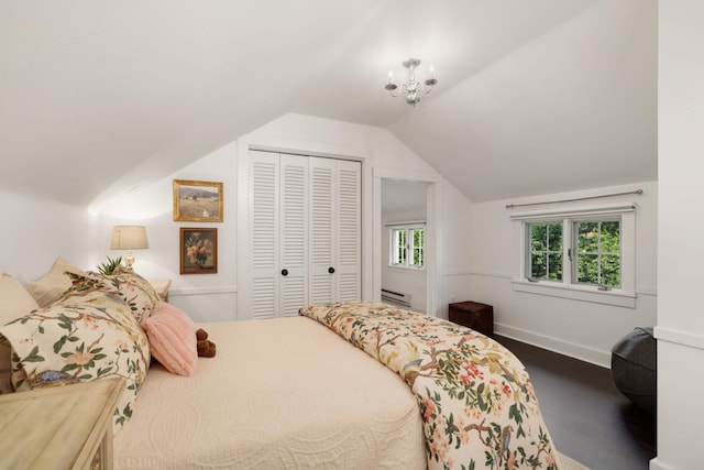 1064 Lombard Ave, Saint Paul, MN 55105 - bedroom with lofted ceiling, a closet, wood finished floors, and baseboard heating