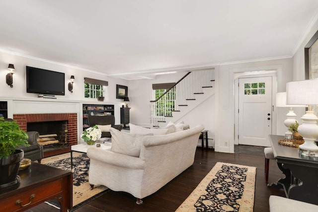 1064 Lombard Ave, Saint Paul, MN 55105 - living area with a fireplace, stairs, ornamental molding, and dark wood finished floors