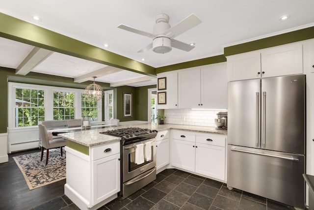 1064 Lombard Ave, Saint Paul, MN 55105 - kitchen featuring appliances with stainless steel finishes, a peninsula, white cabinets, light stone counters, and tasteful backsplash