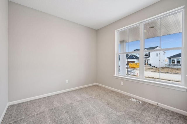1682 Tyrone Dr, Shakopee, MN 55379 - carpeted empty room with baseboards