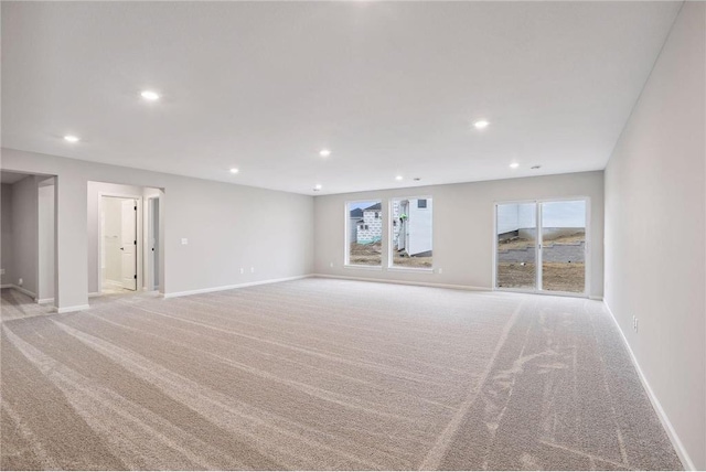 1682 Tyrone Dr, Shakopee, MN 55379 - unfurnished living room featuring light colored carpet and recessed lighting