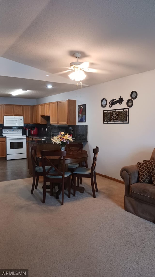 10933 57th St NE, Albertville, MN 55301 - dining area with dark carpet and ceiling fan