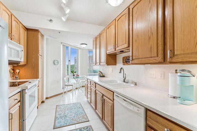 6600 Lyndale Ave S Unit 503, Richfield, MN 55423 - kitchen with white appliances, light countertops, track lighting, and light tile patterned floors