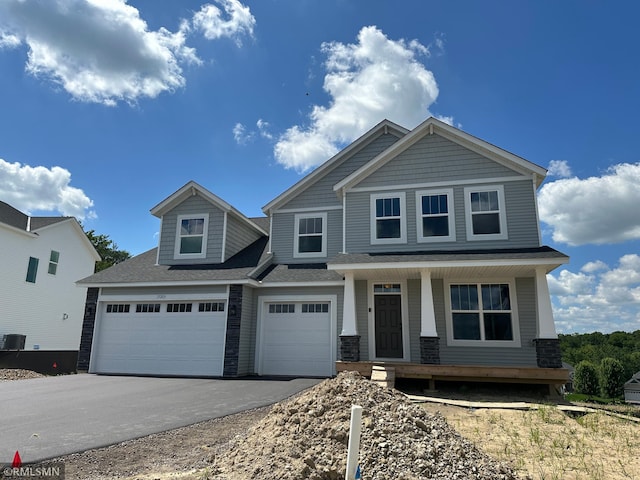 17205 61st St NE, Otsego, MN 55330 - craftsman house with covered porch, asphalt driveway, and roof with shingles