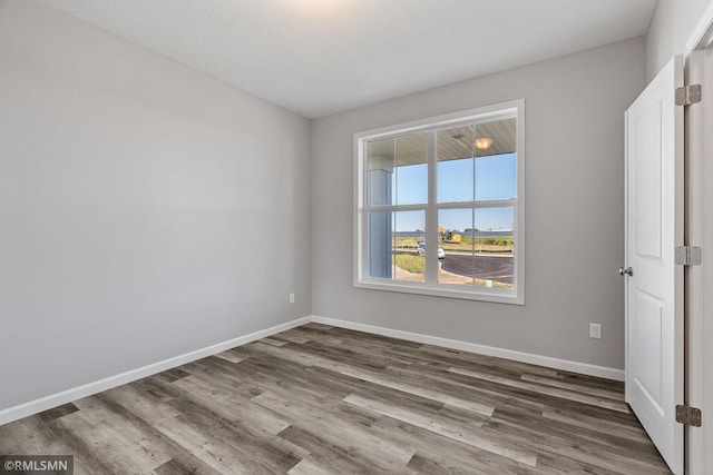17205 61st St NE, Otsego, MN 55330 - spare room with wood finished floors and baseboards
